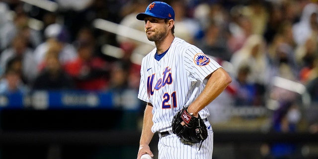 New York Mets starting pitcher Max Scherzer reacts during St. Louis Cardinals' Albert Pujols' at-bat during the sixth inning of a baseball game Wednesday, May 18, 2022, in New York. 