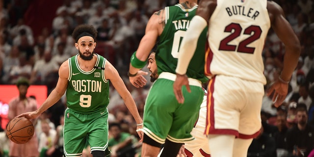 Derrick White #9 of the Boston Celtics dribbles the ball during Game 1 of the 2022 NBA Playoffs Eastern Conference Finals on May 17, 2022 at FTX Arena in Miami, Florida.