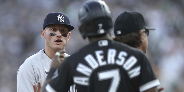 New York Yankees third baseman Josh Donaldson, left, and Chicago White Sox baserunner Tim Anderson (7) exchange words in the first inning on May 13, 2022, at Guaranteed Rate Field in Chicago.