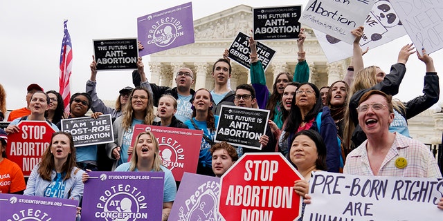 Demonstrators protest outside the U.S. Supreme Court on Monday, May 16, 2022, in Washington, D.C.