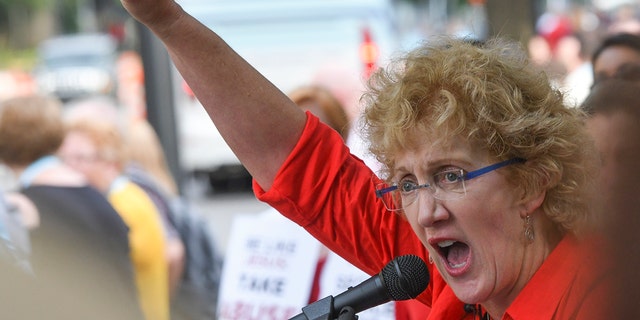 In this Tuesday, June 11, 2019, file photo, Christa Brown, of Denver, Colo., speaks during a rally in Birmingham, Ala., outside the Southern Baptist Convention's annual meeting. Brown, an author and retired attorney, says she was abused by a Southern Baptist minister as a child.