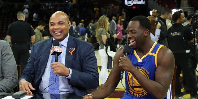 Charles Barkley chats with Draymond Green of the Golden State Warriors after the game against the Cavaliers on June 7, 2017, in Cleveland, Ohio.