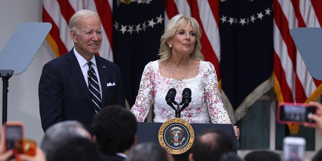 First Lady Jill Biden speaks as President Biden looks on