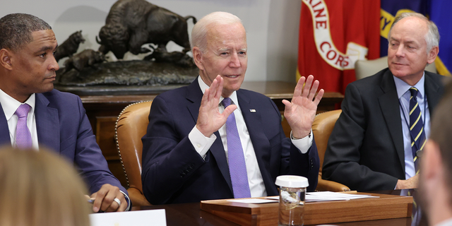 President Joe Biden, flanked by Environmental Protection Agency (EPA) Administrator Michael Regan and senior aide Steve Ricchetti, holds a meeting at the White House in Washington, D.C., on July 22, 2021. 