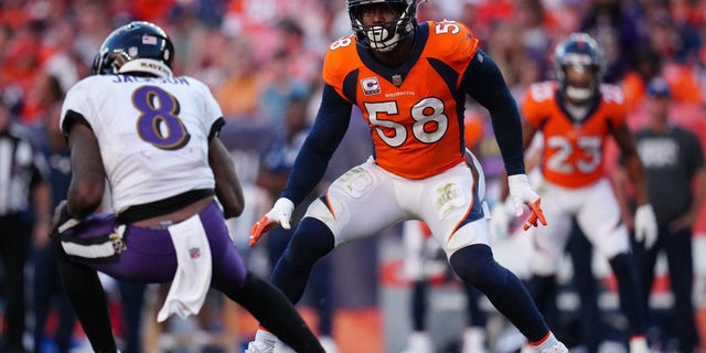 Denver Broncos outside linebacker Von Miller (58) chases down Baltimore Ravens quarterback Lamar Jackson (8) in the second half at Empower Field at Mile High. 