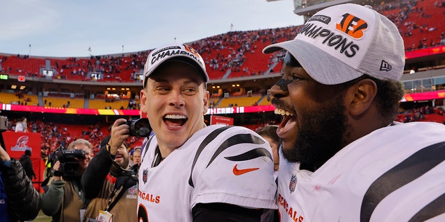 Cincinnati quarterback Joe Burrow and defensive tackle Tyler Shelvin celebrate following the Bengals' overtime win against the Kansas City Chiefs in the AFC Championship Game.