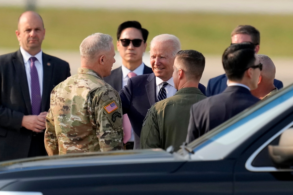 U.S. President Joe Biden, center, is greeted on his arrival at Osan Air Base in Pyeongtaek, South Korea.