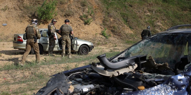 Volunteers from Belarus practice at a shooting range near Warsaw, Poland, Friday, May 20, 2022. Belarusians are among those who have answered a call by Ukrainian President Volodymyr Zelenskyy for foreign fighters to go to Ukraine and join the International Legion for the Territorial Defense of Ukraine.