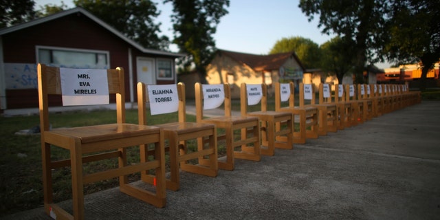 Twenty-one empty chairs are seen outside of a daycare center as a memorial for the victims killed earlier in the week in the elementary school shooting in Uvalde, Texas, Friday, May 27, 2022.