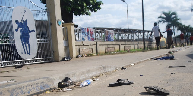 A view of flip fops and sandals on the street, following a stampede in Port Harcourt, Nigeria, Saturday, May 28, 2022. 