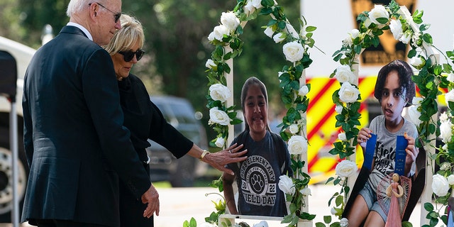 President Joe Biden and first lady Jill Biden visit a memorial at Robb Elementary School to pay their respects to the victims of the mass shooting, Sunday, May 29, 2022, in Uvalde, Texas.