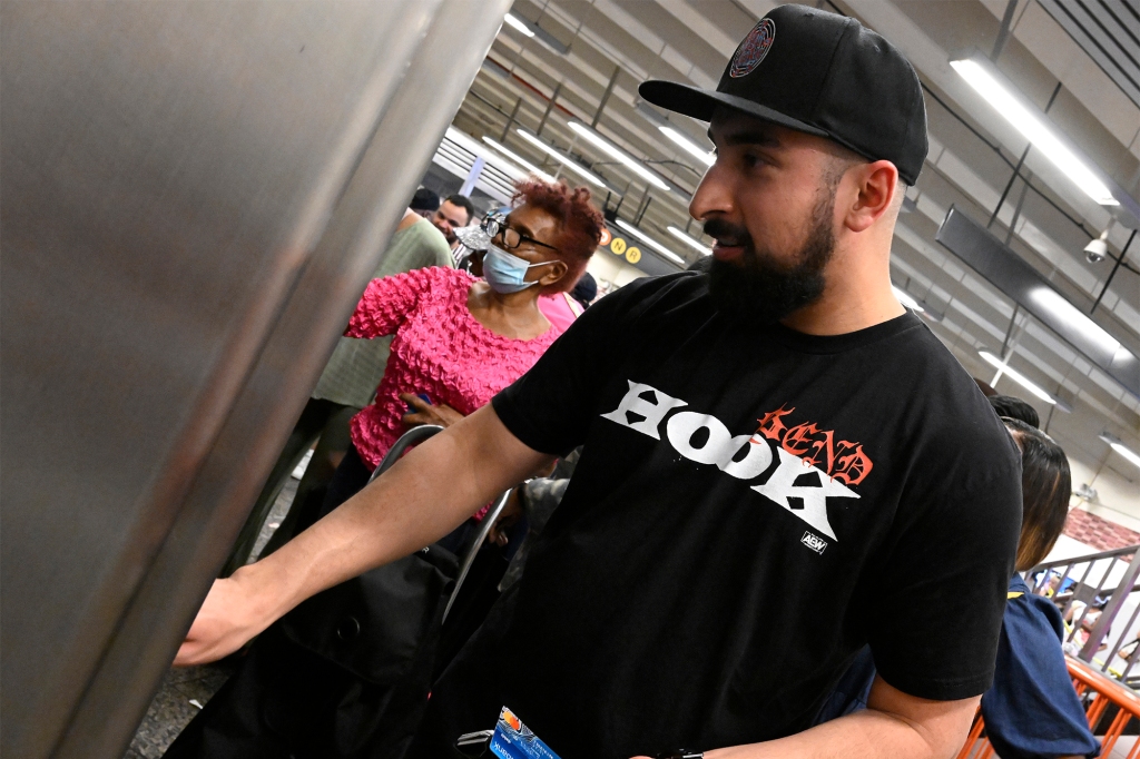 Long Island resident Juan Hernandez is seen buying MetroCards at Barclay Center’s subway station.