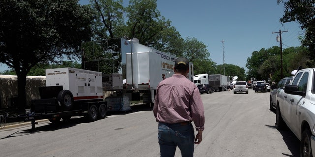 Rep. Gonzales walks across the street from Robb Elementary School in Uvalde, Texas.