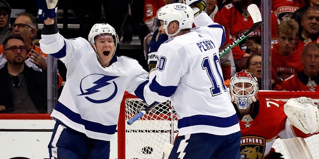 Corey Perry (10) of the Tampa Bay Lightning celebrates his goal with teammates during the first period against the Florida Panthers in Game 2 of the second round of the 2022 Stanley Cup Playoffs at FLA Live Arena May 19, 2022, in Sunrise, Fla.