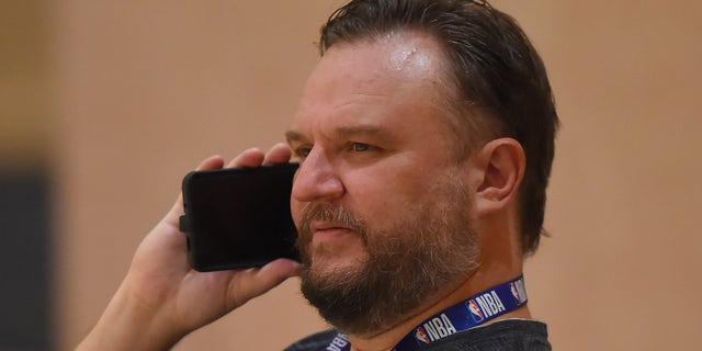 Daryl Morey, former GM of the Houston Rockets, talks on the phone during practice on July 23, 2020, in Orlando, Florida.