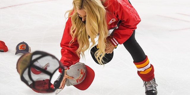 Flames fans throw their hats on the ice after Matthew Tkachuk scored a hat trick against the Edmonton Oilers at Scotiabank Saddledome on May 18, 2022, in Calgary, Canada.