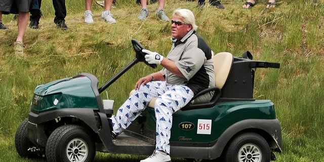 John Daly drives his cart off the 16th tee during the second round of the PGA Championship golf tournament, at Bethpage Black in Farmingdale, N.Y on May 17, 2019. 