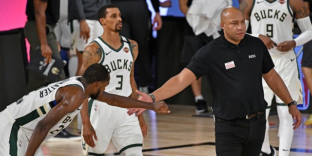 Assistant coach Darvin Ham of the Milwaukee Bucks greets a player during a game against the Miami Heat during Game 5 of the NBA Eastern Conference semifinals Sept. 8, 2020, at The Field House at ESPN Wide World Of Sports Complex in Orlando, Fla.  