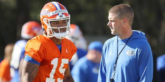 Florida head coach Billy Napier and quarterback Anthony Richardson chat Thursday during the Gators&amp;apos; spring practice in Gainesville, Florida. 