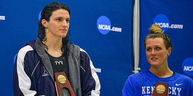 University of Pennsylvania swimmer Lia Thomas and Kentucky swimmer Riley Gaines reacting after they tied for 5th in the 200 Freestyle finals at the NCAA Swimming and Diving Championships on March 18th, 2022, at the McAuley Aquatic Center in Atlanta.