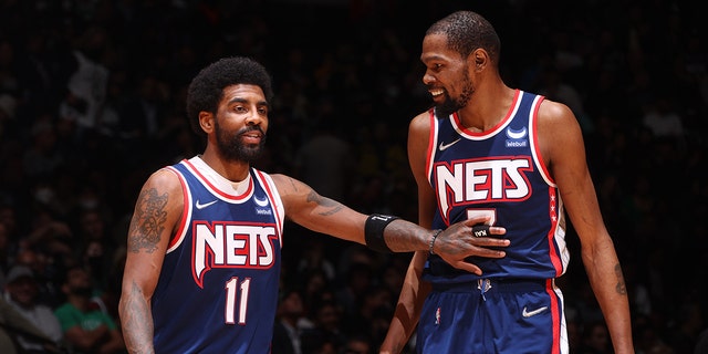 Kyrie Irving #11 talks to Kevin Durant #7 of the Brooklyn Nets during Round 1 Game 4 of the 2022 NBA Playoffs on April 25, 2022 at Barclays Center in Brooklyn, New York. 