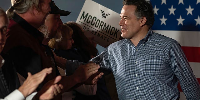 Dave McCormick shakes hands with supporters at a rally to raise support for his Senate bid.