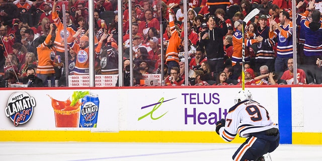 Connor McDavid of the Edmonton Oilers celebrates after scoring the game-winning goal against the Flames on May 26, 2022, in Calgary, Canada.