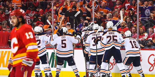 The Edmonton Oilers celebrate after defeating the Flames, 5-4, in overtime on May 26, 2022, in Calgary, Alberta, Canada.