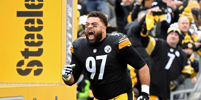 Cameron Heyward #97 of the Pittsburgh Steelers runs onto the field during player introductions prior to the game against the Tennessee Titans at Heinz Field on December 19, 2021 in Pittsburgh, Pennsylvania. 