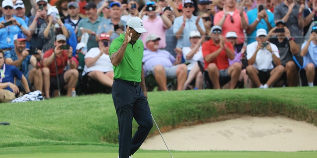 Tiger Woods reacts on the 13th hole during the second round of the 2022 PGA Championship at Southern Hills Country Club May 20, 2022, in Tulsa, Okla. 