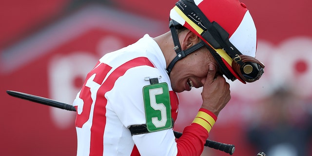 Jockey Jose Ortiz #5 reacts after riding Early Voting to win the 147th Running of the Preakness Stakes at Pimlico Race Course on May 21, 2022 in Baltimore, Maryland. 