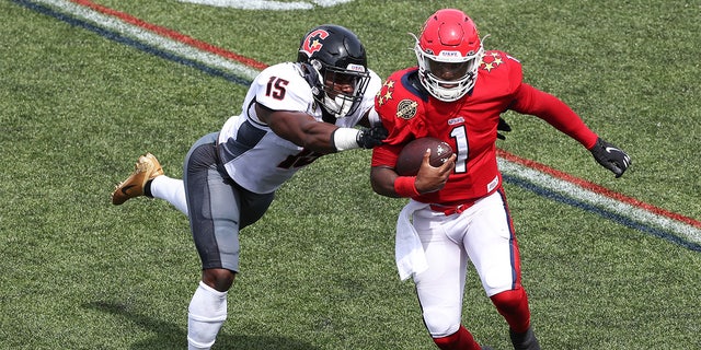 De'Andre Johnson #1 of the New Jersey Generals runs with the ball as Donald Payne #15 of the Houston Gamblers defends in the first quarter of the game at Protective Stadium on May 21, 2022, in Birmingham, Alabama.