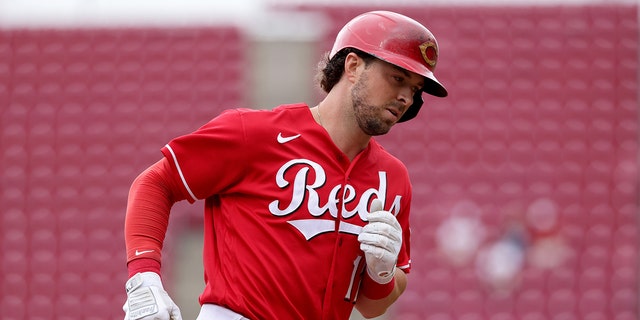 Kyle Farmer of the Cincinnati Reds rounds the bases after hitting a home run in the second inning against the Chicago Cubs at Great American Ball Park May 26, 2022, in Cincinnati. 