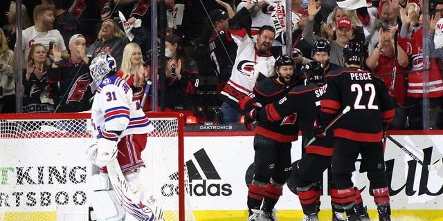 The Hurricanes celebrate a shorthanded goal by Vincent Trocheck on May 26, 2022, in Raleigh, North Carolina.