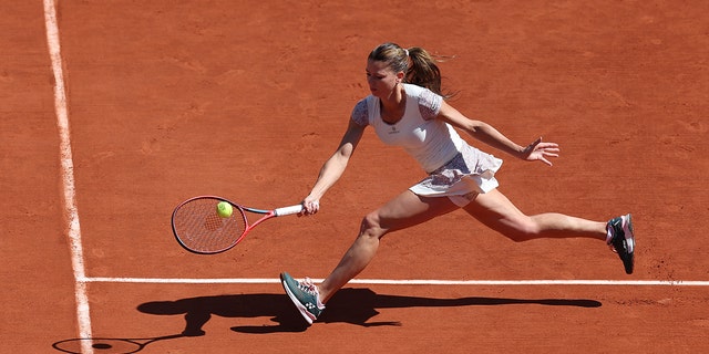 Camila Giorgi of Italy is seen in action against Daria Kasatkina of Russia during day nine of the French Open at Roland Garros on May 30, 2022 in Paris.