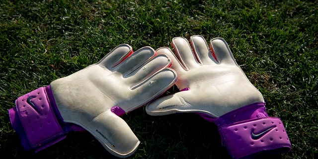 A pair of goalie gloves on the field at the conclusion of the Division II women's soccer championship at the Swope Soccer Village Dec. 2, 2017, in Kansas City, Mo. 