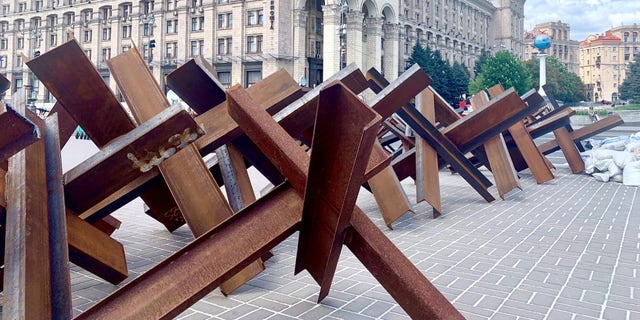 Steel barriers line the sidewalk in central Kyiv.