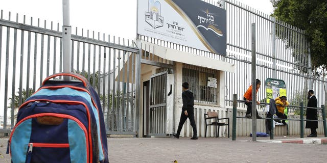 A school bag lies in front of a school in the central Israeli coastal city of Netanya. (Photo by JACK GUEZ / AFP) (Photo by JACK GUEZ/AFP via Getty Images)