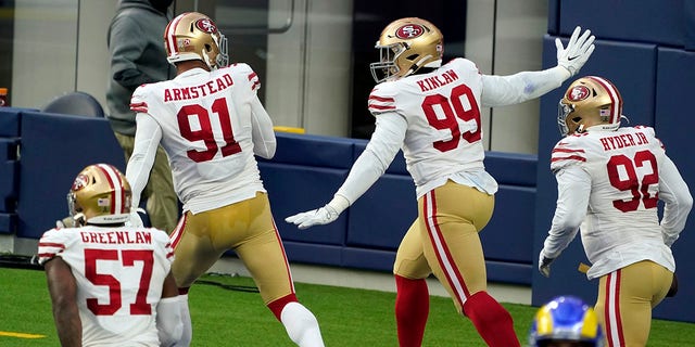 San Francisco 49ers defensive tackle Javon Kinlaw (99) celebrates in the end zone after returning an interception for a touchdown during the second half of an NFL football game Sunday, Nov. 29, 2020, in Inglewood, Calif.