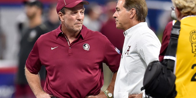 Head coach Nick Saban of the Alabama Crimson Tide speaks with head coach Jimbo Fisher of the Florida State Seminoles prior to their game at Mercedes-Benz Stadium on September 2, 2017 in Atlanta, Georgia.