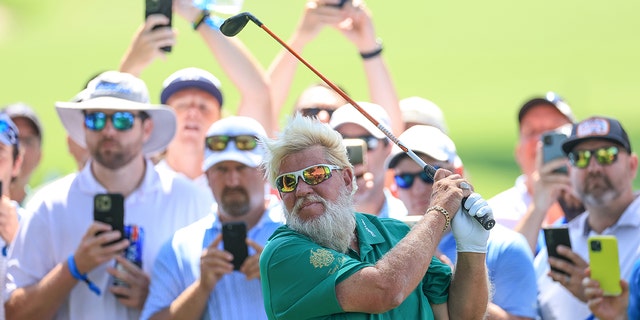 John Daly of The United States plays his second shot on the 16th hole during the first round of the 2022 PGA Championship at Southern Hills Country Club on May 19, 2022 in Tulsa, Oklahoma.