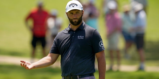 Jon Rahm of Spain stands on the 13th green during a practice round for the PGA Championship golf tournament Wednesday, May 18, 2022, in Tulsa, Okla.