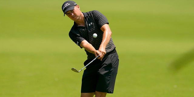 Jordan Spieth chips to the green during a practice round for the PGA Championship golf tournament, Wednesday, May 18, 2022, in Tulsa, Oklahoma.