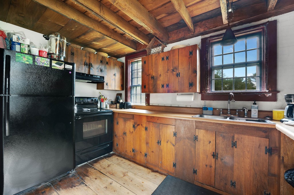 The kitchen has wooden cabinets.