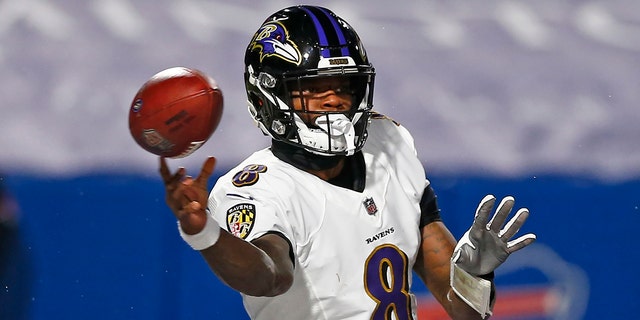 Baltimore Ravens quarterback Lamar Jackson throws a pass during the first half of an NFL divisional round football game against the Buffalo Bills in Orchard Park, N.Y. on April 30, 2021. 