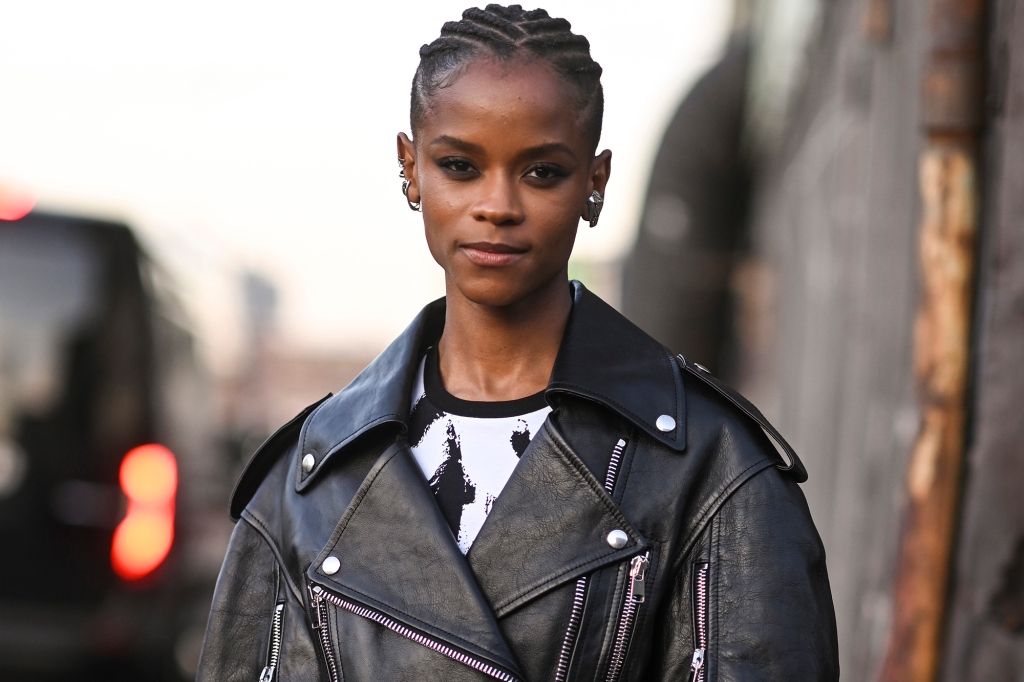 NEW YORK, NEW YORK - MARCH 15: Letitia Wright is seen wearing a black jacket and black leather skirt outside the Alexander McQueen AW22 show on March 15, 2022 in the borough of Brooklyn, New York. (Photo by Daniel Zuchnik/Getty Images)