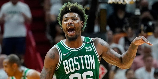 Boston Celtics guard Marcus Smart (36) gestures during the first half of Game 2 of the NBA basketball Eastern Conference finals playoff series against the Miami Heat, Thursday, May 19, 2022, in Miami. 