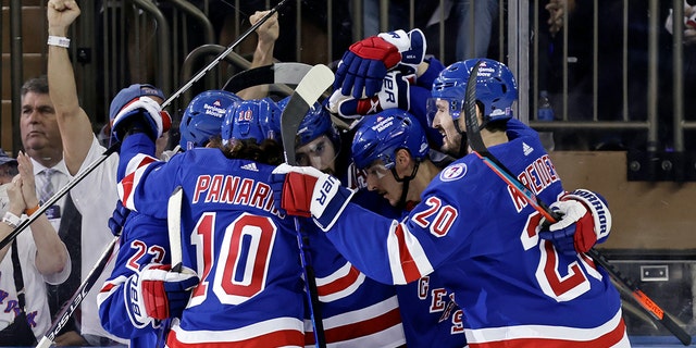 New York Rangers' Mika Zibanejad is congratulated by teammates after scoring a goal against the Carolina Hurricanes in Game 3 of an NHL hockey Stanley Cup second-round playoff series, Sunday, May 22, 2022, in New York. 