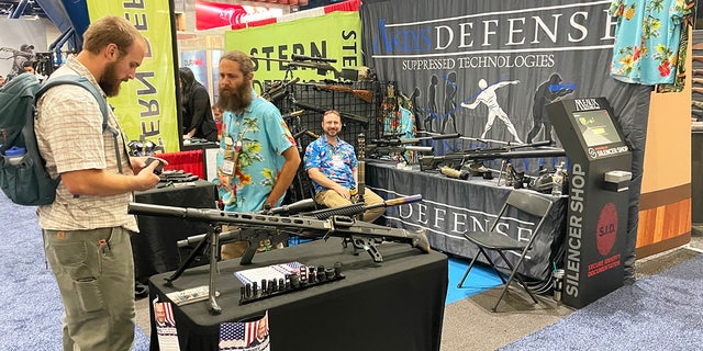 Different booths are shown on the exhibit floor of the 2022 NRA convention in Houston.