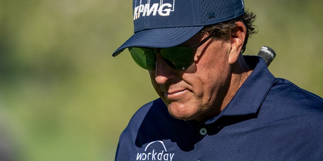 Phil Mickelson walks between holes during the second round of the Charles Schwab Cup Championship at Phoenix Country Club on Nov. 12, 2021, in Arizona.